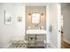 Modern bathroom featuring a floating vanity, unique mirror, and stylish light fixtures at 5801 N 22Nd Pl, Phoenix, AZ 85016