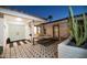 Charming front entrance featuring double doors, stylish accents, and a welcoming outdoor seating area with patterned tile at 5801 N 22Nd Pl, Phoenix, AZ 85016