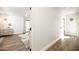 Hallway leading to rooms with hardwood floors and modern decor at 5801 N 22Nd Pl, Phoenix, AZ 85016