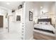 Spacious walk-in closet with custom shelving and drawer units adjacent to a serene main bedroom at 5801 N 22Nd Pl, Phoenix, AZ 85016