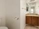 Half bath with granite countertop, wood cabinet, and tile flooring at 5808 E Brown Rd # 110, Mesa, AZ 85205
