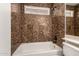 Modern bathroom with textured tile surround and updated fixtures, offering a spa-like retreat at 5808 E Brown Rd # 110, Mesa, AZ 85205