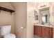 Bathroom featuring single sink vanity with wood cabinet and tile flooring at 5808 E Brown Rd # 110, Mesa, AZ 85205