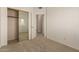 Bedroom with a closet and doorway to another room at 5808 E Brown Rd # 110, Mesa, AZ 85205