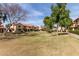 View of townhomes with red tile roofs and green common area at 5808 E Brown Rd # 110, Mesa, AZ 85205