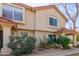 Inviting two-story home with a charming red tile roof and manicured landscaping at 5808 E Brown Rd # 110, Mesa, AZ 85205