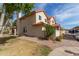 Inviting home exterior with lush landscaping, a well-maintained lawn, and ample parking at 5808 E Brown Rd # 110, Mesa, AZ 85205