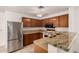 Kitchen featuring granite countertops, stainless steel appliances, and a breakfast bar at 5808 E Brown Rd # 110, Mesa, AZ 85205