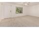Bright living area features a front door and a window providing ample natural light at 5808 E Brown Rd # 110, Mesa, AZ 85205