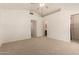 Bright main bedroom featuring neutral carpeting, a ceiling fan and walk in closet at 5808 E Brown Rd # 110, Mesa, AZ 85205