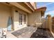 Cozy outdoor patio featuring textured concrete, a patterned rug, and double doors at 5808 E Brown Rd # 110, Mesa, AZ 85205