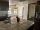 Stylish kitchen view showcasing island with counter tops, sink and stainless steel fridge at 6242 E Maverick Rd, Paradise Valley, AZ 85253