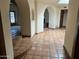 Open living area with tile flooring, arched doorways and bright natural light at 6242 E Maverick Rd, Paradise Valley, AZ 85253