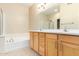 Spacious bathroom with double sink and soaking tub at 6605 N 93Rd Ave # 1024, Glendale, AZ 85305