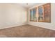 Bedroom with neutral walls and wood shutter blinds at 6605 N 93Rd Ave # 1024, Glendale, AZ 85305