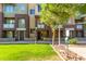 Inviting multi-story condo complex with well-maintained lawn and lush landscaping at 6605 N 93Rd Ave # 1024, Glendale, AZ 85305