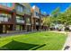 Attractive condo building featuring manicured lawn and inviting curb appeal at 6605 N 93Rd Ave # 1024, Glendale, AZ 85305