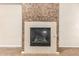 Cozy fireplace with decorative stone surround, perfect for adding warmth and ambiance to the living space at 6605 N 93Rd Ave # 1024, Glendale, AZ 85305