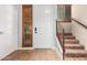 Entryway featuring wood-look flooring, shuttered windows and staircase at 6605 N 93Rd Ave # 1024, Glendale, AZ 85305