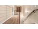 Hallway with natural light from a window and modern railing along the stairway leading to the next level at 6605 N 93Rd Ave # 1024, Glendale, AZ 85305