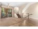 Open-concept living room with staircase and natural lighting at 6605 N 93Rd Ave # 1024, Glendale, AZ 85305