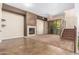 Spacious living area featuring a stone fireplace and wood-look floors at 6605 N 93Rd Ave # 1024, Glendale, AZ 85305