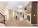 The staircase and fireplace accentuate the open floor plan, creating a welcoming and airy atmosphere at 6605 N 93Rd Ave # 1024, Glendale, AZ 85305