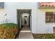 Gated entrance to a townhouse with desert landscaping and a red tiled roof at 6812 N 35Th Ave # G, Phoenix, AZ 85017