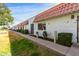 Row of townhouses showcasing red tile roofs, stucco exteriors, and mature landscaping at 6812 N 35Th Ave # G, Phoenix, AZ 85017