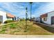 Community street featuring townhouses with red tile roofs and desert landscaping at 6812 N 35Th Ave # G, Phoenix, AZ 85017