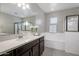 Bathroom featuring a combination tub and shower, vanity, and sink at 7057 E Diamond St, Scottsdale, AZ 85257