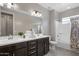 Bathroom features a double sink vanity, soaking tub and tiled floor at 7057 E Diamond St, Scottsdale, AZ 85257