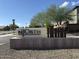 Community entrance sign, mature trees, and well-maintained landscaping create an inviting atmosphere at 7057 E Diamond St, Scottsdale, AZ 85257