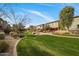 Expansive lawn area showcasing the community's landscaping and walkways between the residential buildings at 7057 E Diamond St, Scottsdale, AZ 85257