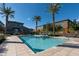 Bright community pool area with lounge chairs, palm trees, and well-maintained landscaping near townhouses at 7057 E Diamond St, Scottsdale, AZ 85257