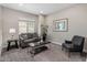 Living room with neutral paint, carpet, window, and contemporary furniture at 7057 E Diamond St, Scottsdale, AZ 85257