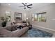 Comfortable living room with plush seating, a ceiling fan, and natural light at 7057 E Diamond St, Scottsdale, AZ 85257