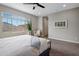 This main bedroom features a ceiling fan, neutral walls, and bright natural light at 7057 E Diamond St, Scottsdale, AZ 85257