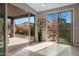 Bright sunroom features sliding glass doors with views to outdoor living and patio at 7057 E Diamond St, Scottsdale, AZ 85257