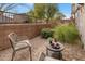 Outdoor patio seating area with a table and chairs plus lush surrounding landscape at 7057 E Diamond St, Scottsdale, AZ 85257