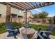 Community patio space with table, chairs, and privacy fence at 7057 E Diamond St, Scottsdale, AZ 85257