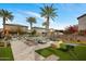 Community pool area with lounge chairs, palm trees, and manicured landscaping at 7057 E Diamond St, Scottsdale, AZ 85257