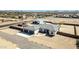 An aerial view of a desert single Gathering home with a detached garage and long driveway on a large lot at 711 W Paso Nuevo Dr, Phoenix, AZ 85086