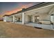 A covered back patio with ceiling fans overlooks the backyard, with plenty of room for entertaining at 711 W Paso Nuevo Dr, Phoenix, AZ 85086