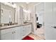 Elegant bathroom featuring double sinks and decorative mirrors, exuding luxury and comfort at 711 W Paso Nuevo Dr, Phoenix, AZ 85086