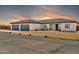 An exterior view of a single Gathering home featuring a large, three-car garage and desert landscaping at 711 W Paso Nuevo Dr, Phoenix, AZ 85086