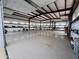 Massive shop garage featuring tall ceilings, insulated walls and coated floors with plenty of storage space at 711 W Paso Nuevo Dr, Phoenix, AZ 85086