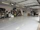 Well-organized garage with epoxy flooring, shelving, and ample storage space, making organization a breeze at 711 W Paso Nuevo Dr, Phoenix, AZ 85086