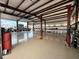 Massive shop garage featuring tall ceilings, insulated walls and coated floors with automotive lift at 711 W Paso Nuevo Dr, Phoenix, AZ 85086