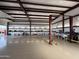 Massive shop garage featuring tall ceilings, insulated walls and coated floors with automotive lift at 711 W Paso Nuevo Dr, Phoenix, AZ 85086